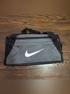Nike Gray and Black Duffel travel bag gym bag with White Swoosh Logo